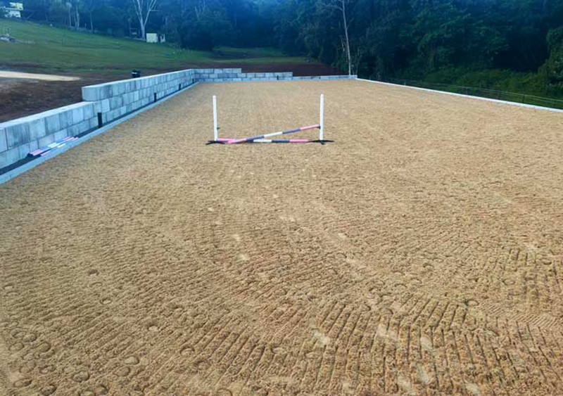 Completed horse arena with wax sand surface