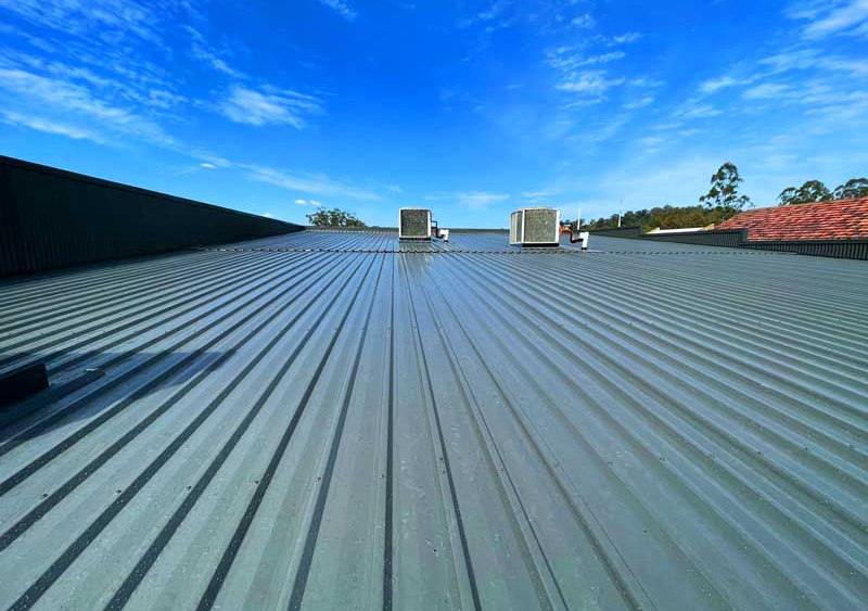 Commercial metal roof installed by Bruce Jobson Plumbing and Roofing